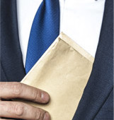 Corruption In South Africa: A Man Putting An Envelope In His Suit Pocket